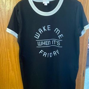 Lularoe Liv tee size S.  Black background.  White trim at neckband sleeves